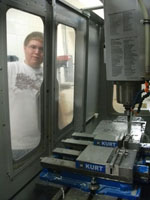 student watches CNC Milling machine