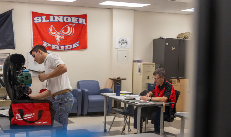 Mr Apel judging Job Skill Demonstration.