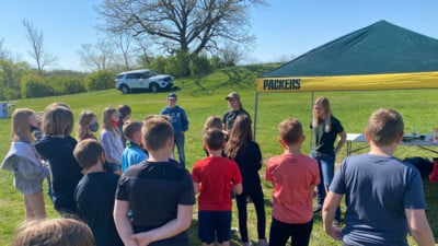 MS FFA students outside on sunny day in field