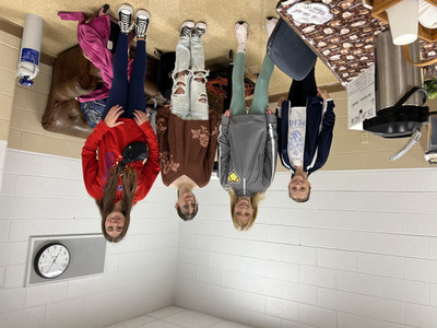 Students standing by coffee makers