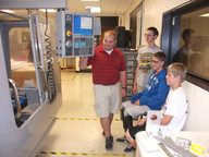 student uses CNC Mill in metals lab